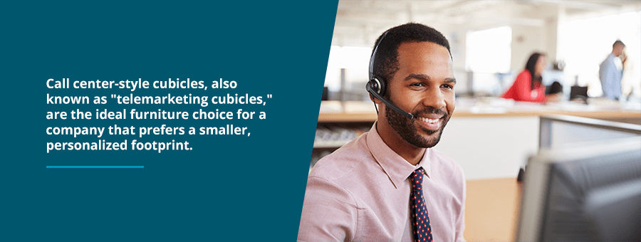 Man sitting at a telemarketing cubicle talking into a headset